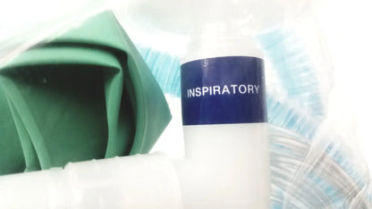 White cylindrical bottle with navy blue label reading inspiratory used in breathing bag coaxial breathing circuit product