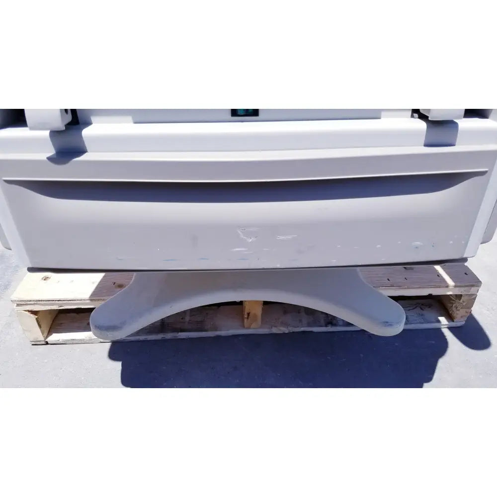 Light gray plastic base with curved foot-like supports for brewer access high-low exam table