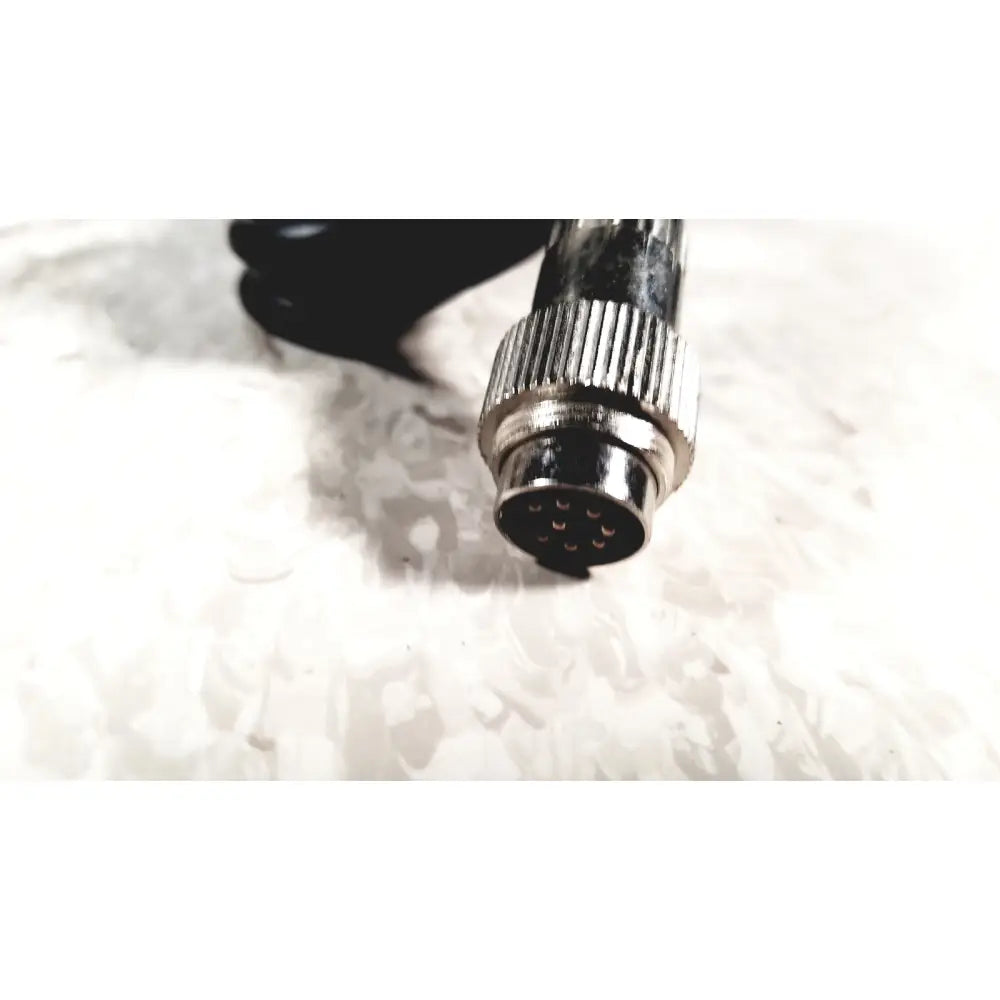 Silver-colored metal connector with threaded ridged housing and nine pin contacts for brewer high low power exam foot pedal