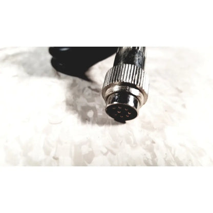 Silver-colored metal connector with threaded ridged housing and nine pin contacts for brewer high low power exam foot pedal