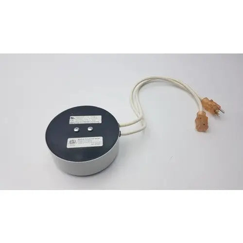 Gray cylindrical bridegeport magnetics tortran ip600 power transformer with black top and beige cord with orange plugs