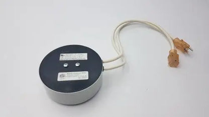 Gray cylindrical bridegeport magnetics tortran ip600 power transformer with black top and beige cord with orange plugs