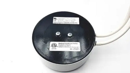 Black and silver bridegeport magnetics tortran tis1000-600watt-1120 medical transformer with two white wires