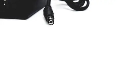 Black power adapter with coiled cable and cylindrical connector for bridgepower corp bpm050s12f02 medical power supply