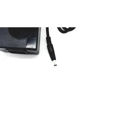 Black plastic laptop charger with coiled power cord and cylindrical connector for bridgepower corp bpm050s12f02 medical power supply