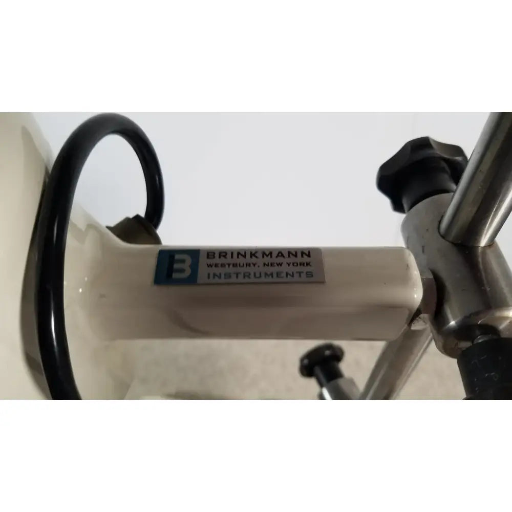 White brinkmann kinematica homogenizer mixer with metallic handle and black tubing for laboratory use
