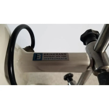White brinkmann kinematica homogenizer mixer with metallic handle and black tubing for laboratory use