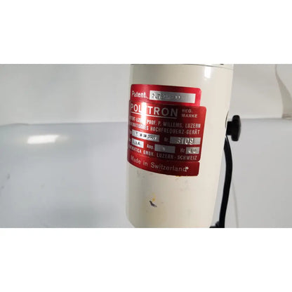 Cream-colored cylindrical poltron high-frequency generator with red patent label on brinkmann kinematica homogenizer mixer