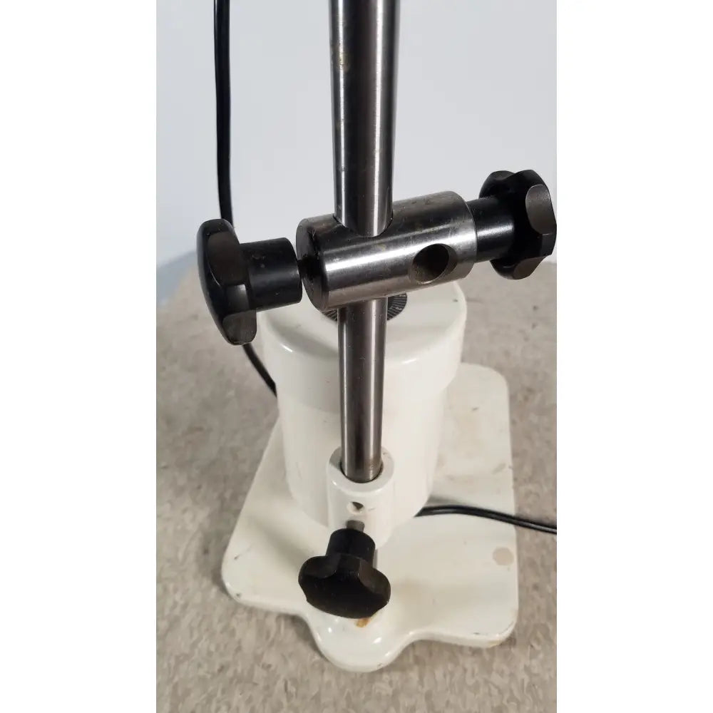 White ceramic base with black knobs and metallic rod of brinkmann kinematica homogenizer mixer for lab use