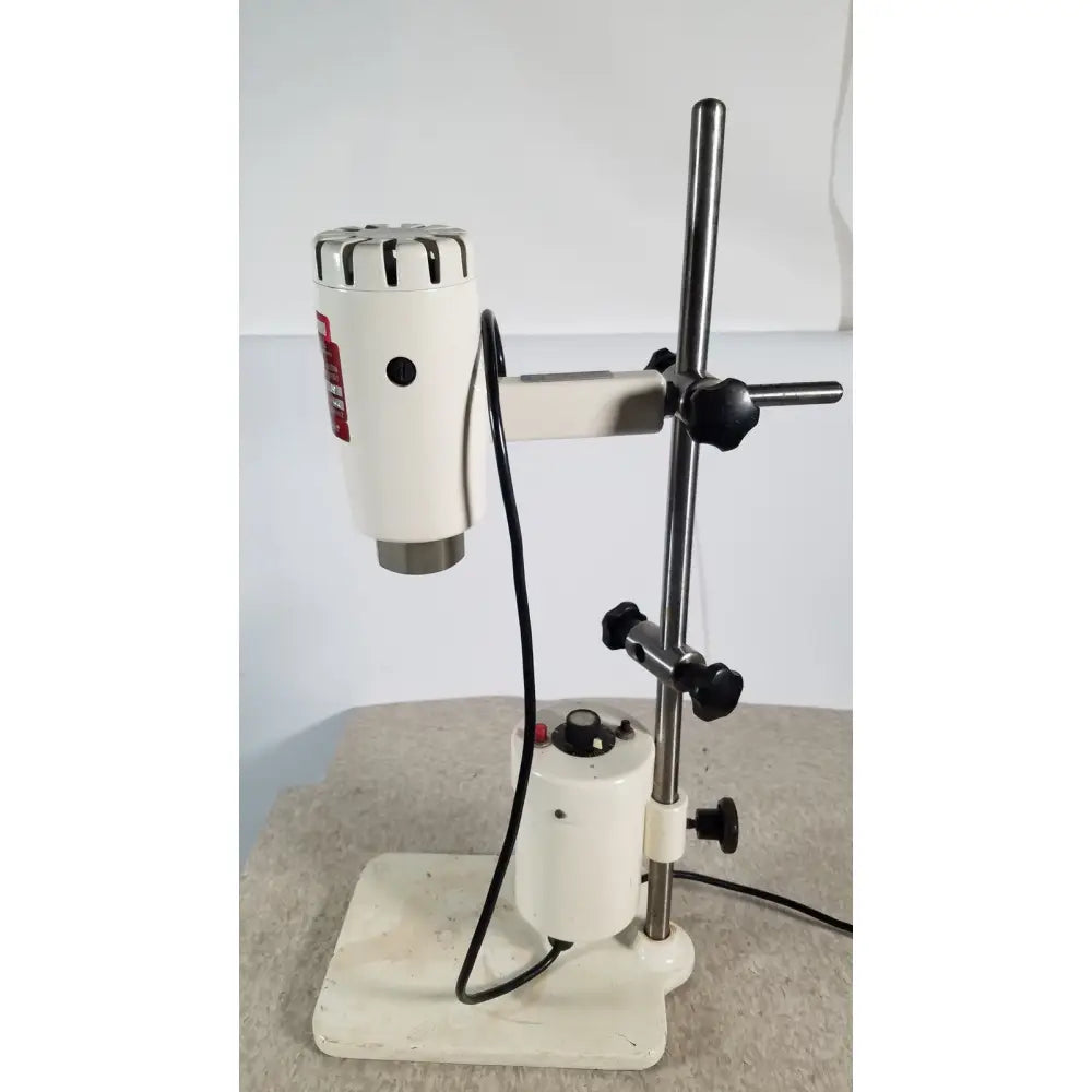 White brinkmann kinematica homogenizer mixer with metallic top and black knobs mounted on adjustable stand