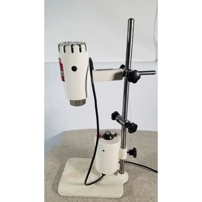 White brinkmann kinematica homogenizer mixer with metallic top and black knobs mounted on adjustable stand