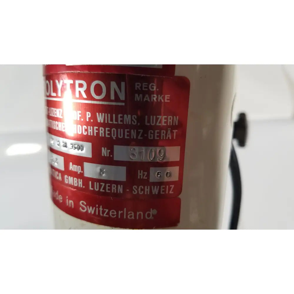 Red label on cream-colored brinkmann kinematica homogenizer mixer polytron high-frequency device made in switzerland
