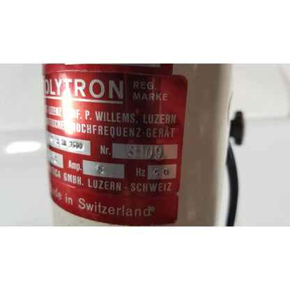 Red label on cream-colored brinkmann kinematica homogenizer mixer polytron high-frequency device made in switzerland