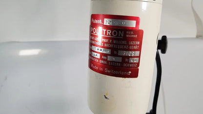 Cream-colored cylindrical poltron high-frequency generator with red patent label on brinkmann kinematica homogenizer mixer