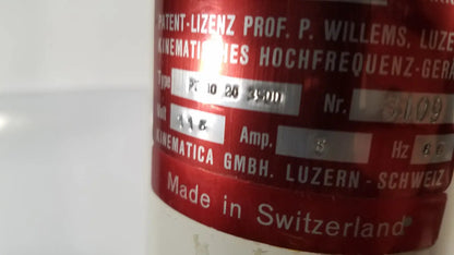 Red cylindrical brinkmann kinematica homogenizer mixer with silver metallic label made in switzerland showing technical specs
