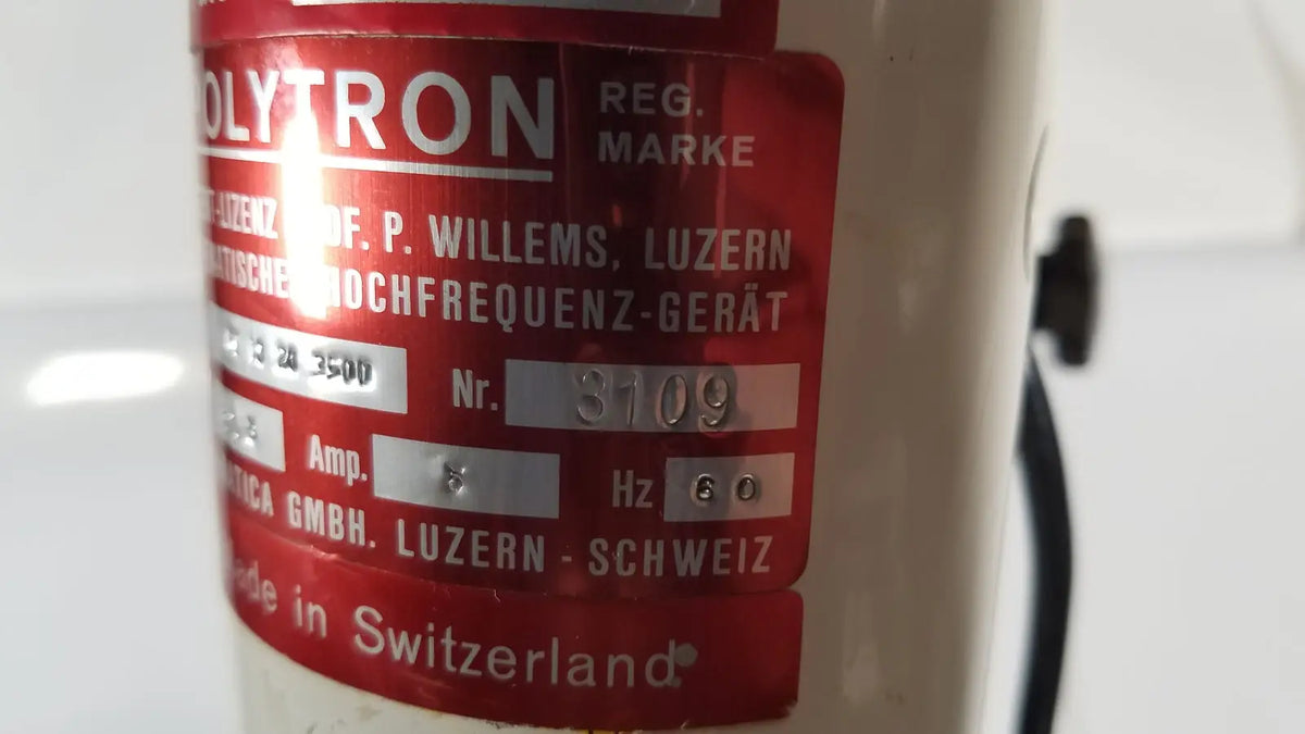 Red label on cream-colored brinkmann kinematica homogenizer mixer polytron high-frequency device made in switzerland