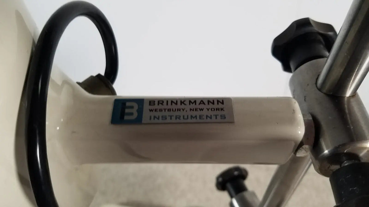White brinkmann kinematica homogenizer mixer with metallic handle and black tubing for laboratory use
