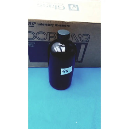 Dark amber brown glass chemical bottle with black screw-top cap and white label 53 for reagent storage lab use