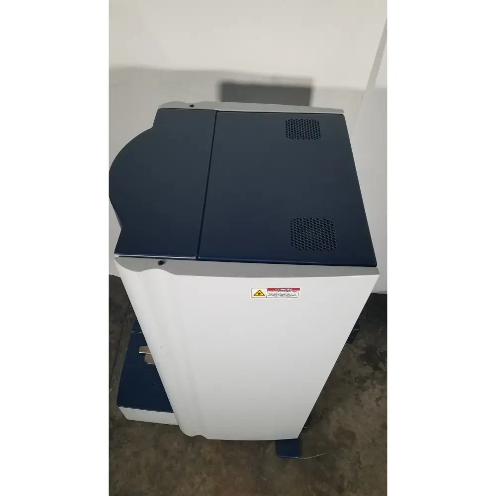 Bruker microflex mass spectrometer with white and navy blue multifunction printer for reuse medical applications