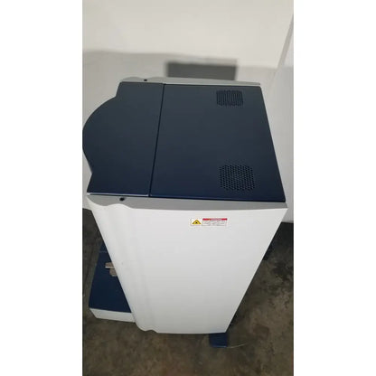 Bruker microflex mass spectrometer with white and navy blue multifunction printer for reuse medical applications