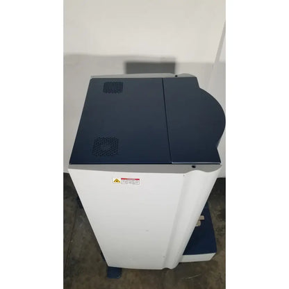 Bruker Microflex mass spectrometer featuring a white and navy blue multifunction printer for medical reuse applications