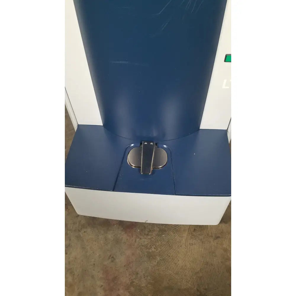 Blue and white bruker microflex lt/sh mass spectrometer kiosk with metallic foot pedal for reuse medical applications
