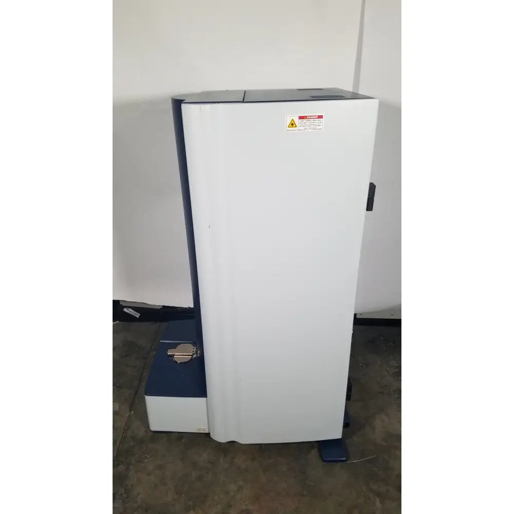 White and blue bruker microflex LT/SH mass spectrometer with warning label for reuse medical applications