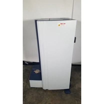 White and blue bruker microflex LT/SH mass spectrometer with warning label for reuse medical applications
