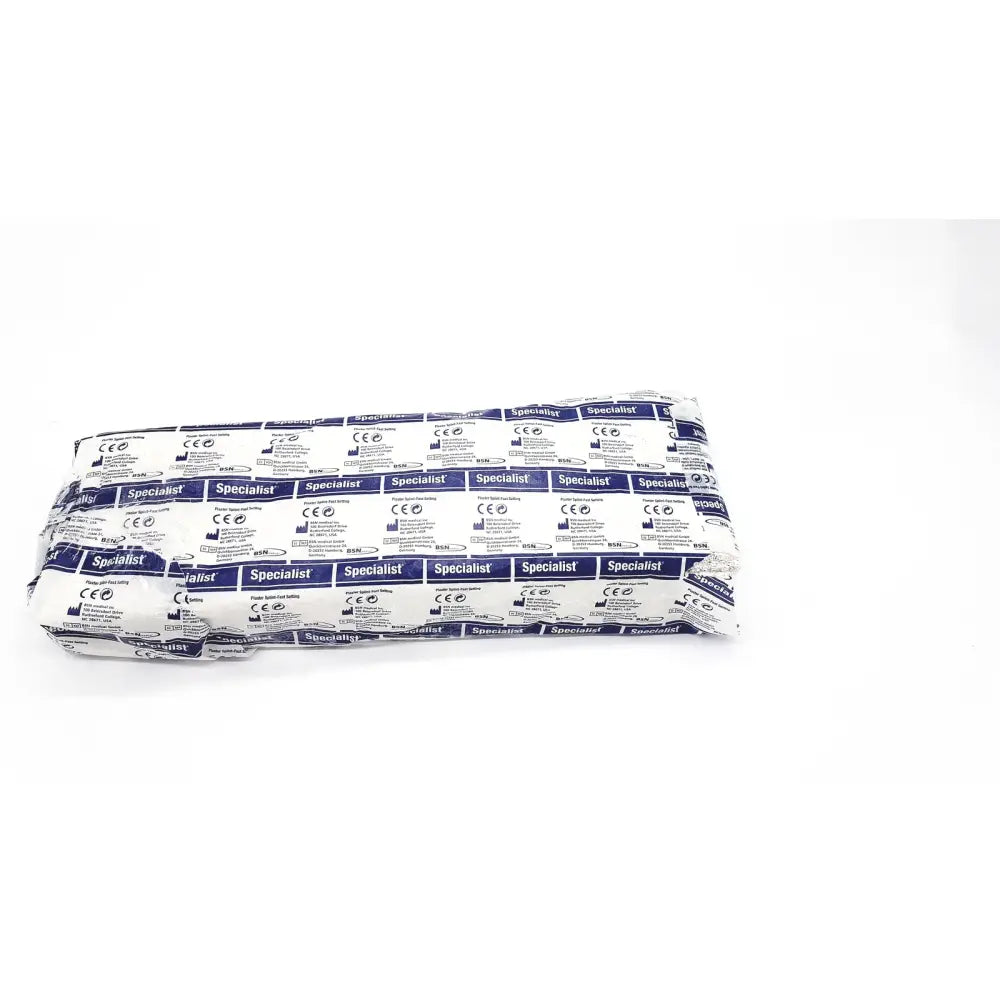 A neatly folded package of bsn medical specialist sterile gauze pads wrapped in white and blue printed paper for fast setting specialist plaster bandage use