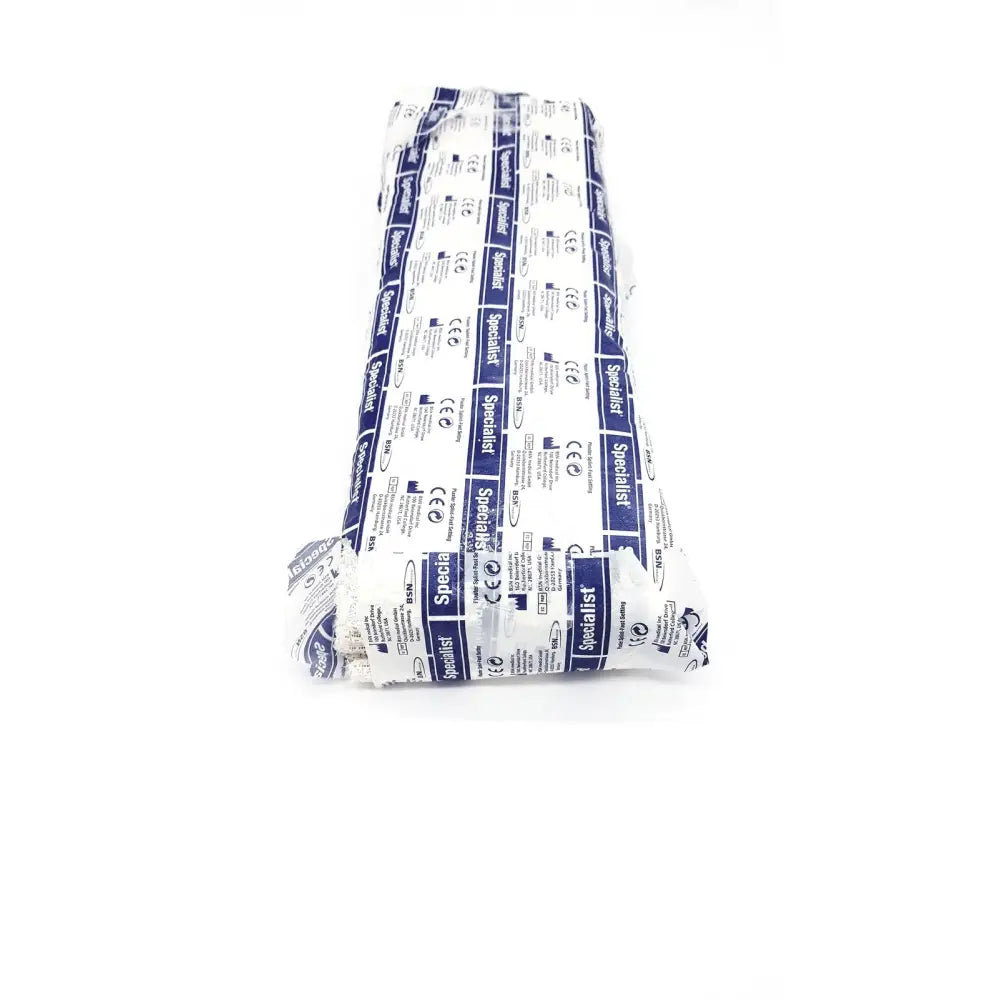 A roll of white and blue patterned bsn medical specialist plaster bandage in plastic packaging for fast setting use