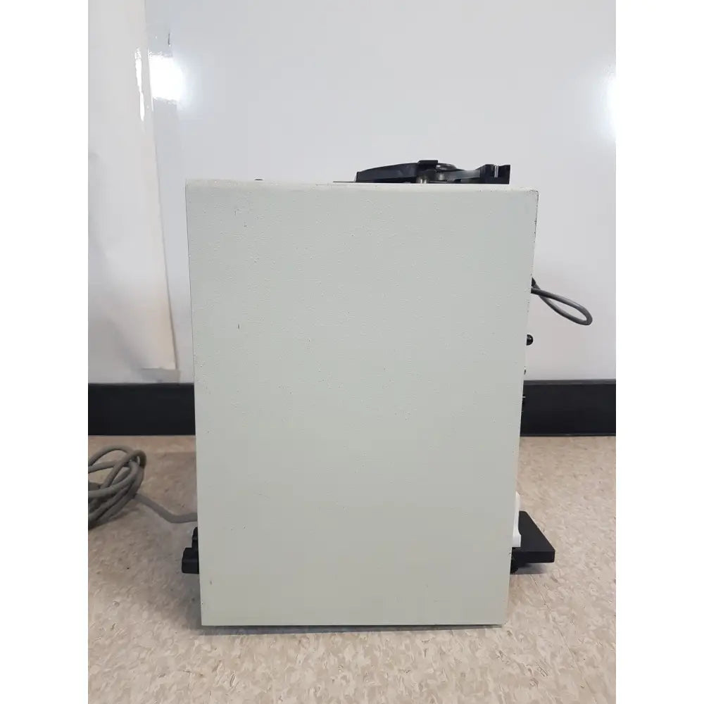 Light gray rectangular buchler instruments auto densi-flow II C density gradient fractionator with black components on top and sides