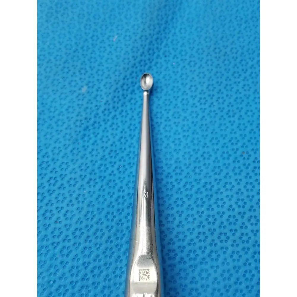 Silver stainless steel buggles spratt bone curette with slender tapered shaft and rounded tip for surgical orthopedic use