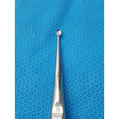 Silver stainless steel buggles spratt bone curette with slender tapered shaft and rounded tip for surgical orthopedic use