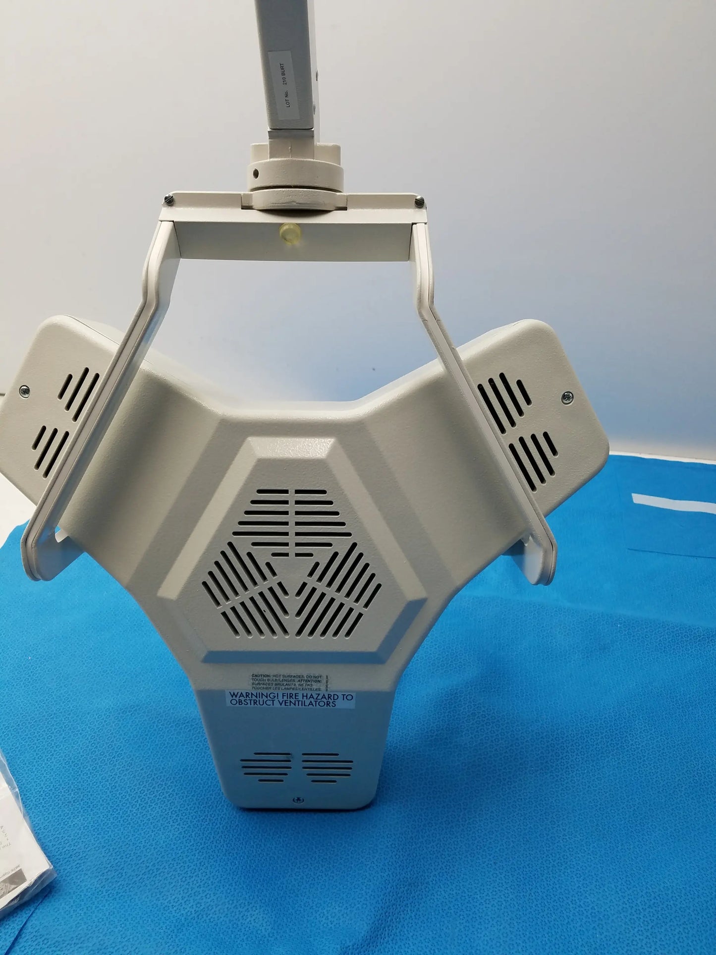 White burton medical outpatient ii coolspot ii medical examination lamp with hexagonal body and adjustable arm wall mount