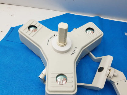 White plastic burton medical outpatient ii coolspot ii examination light with three adjustable heads and wall mount assembly medical equipment