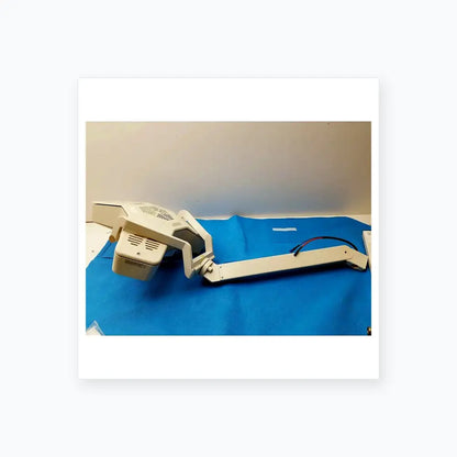 White adjustable-arm medical equipment examination lamp with articulated joints and ventilation grilles by smiths medical