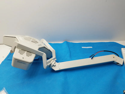 White adjustable-arm medical equipment examination lamp with articulated joints and ventilation grilles by smiths medical
