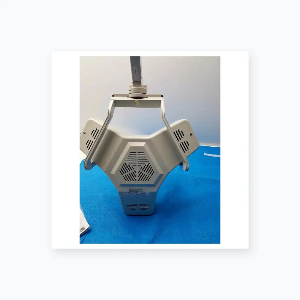 White burton medical outpatient ii coolspot ii medical examination lamp with hexagonal body and adjustable arm wall mount
