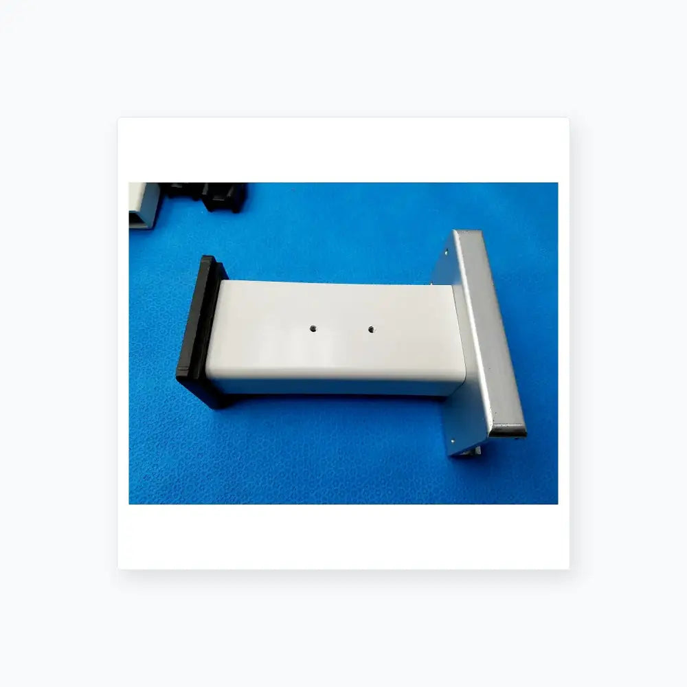 White rectangular plastic housing with black and silver metal brackets for burton medical outpatient ii examination light wall mount assembly