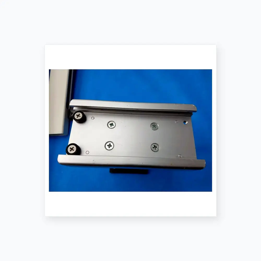 Silver aluminum mounting bracket with black rubber caps on screws for burton medical outpatient ii examination light wall mount assembly