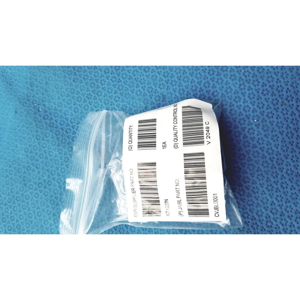 A white label with black barcode and text sealed in a clear plastic bag for burton ultraviolet examining light 031980