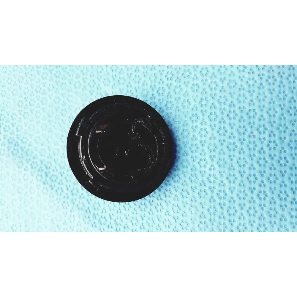 Black circular plastic lid with textured surface and ridges for burton ultraviolet examining ultraviolet examining light