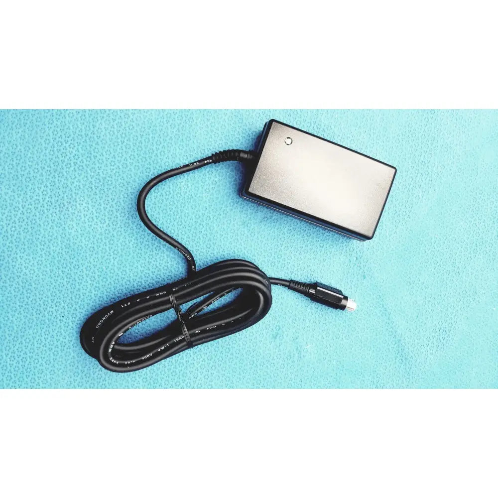 Black rectangular burton ultraviolet examining power adapter with coiled cable and usb connector for ultraviolet examining light