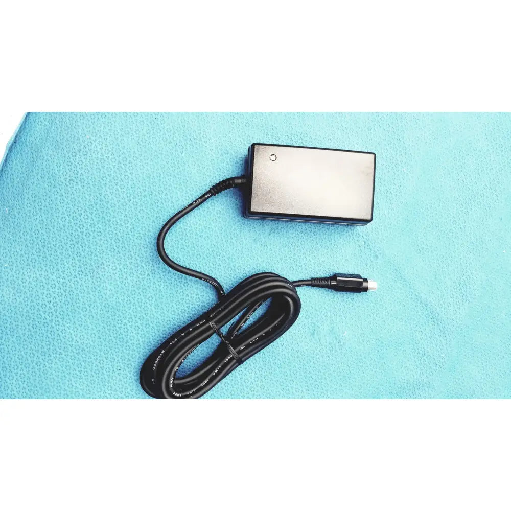 Black rectangular power adapter with coiled cable and usb for burton ultraviolet examining ultraviolet examining light