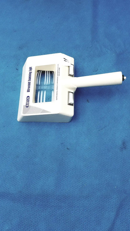 White plastic burton ultraviolet examining light with blue illuminated strips visible through transparent window