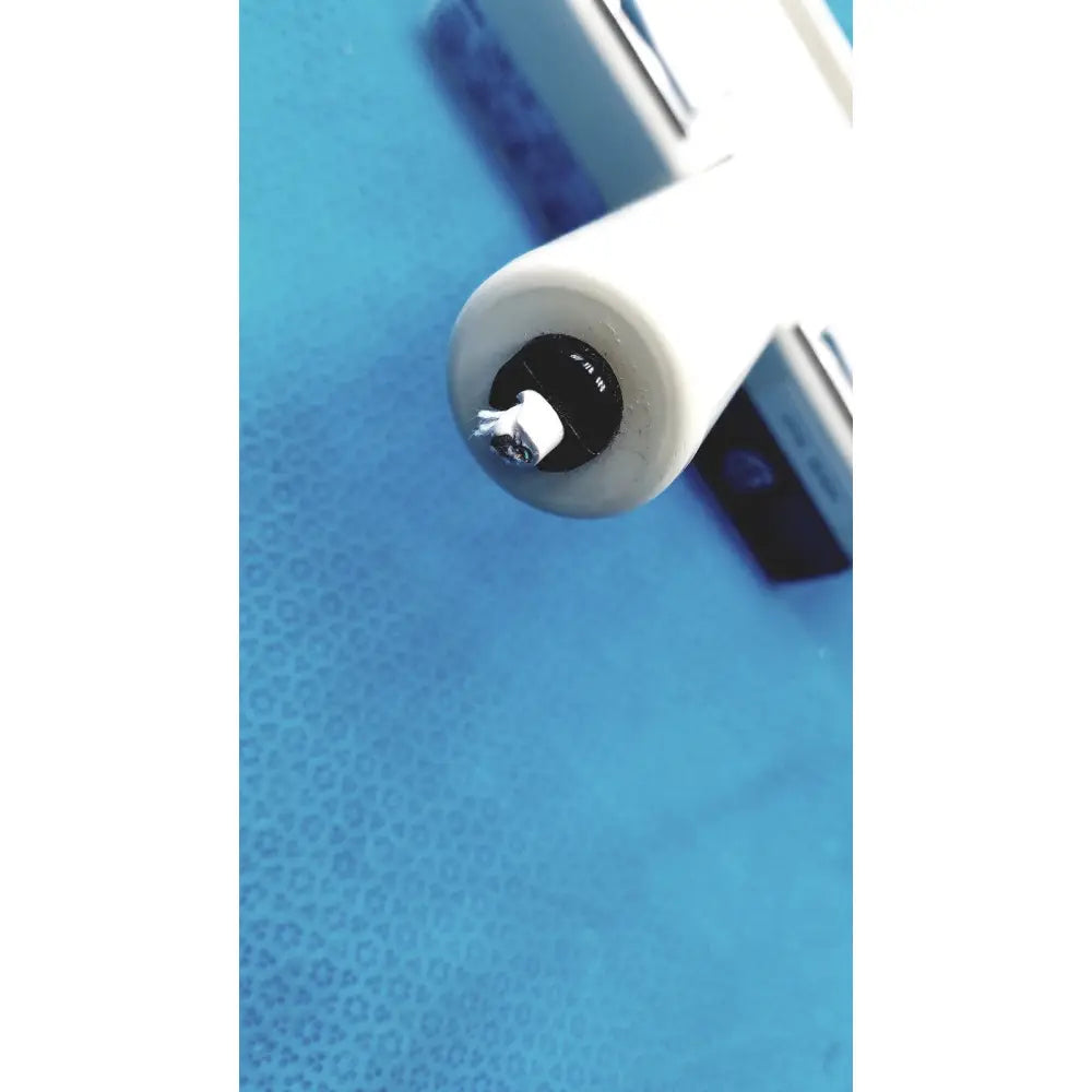 White cylindrical burton ultraviolet examining light with black circular base and small white protrusion for medical use
