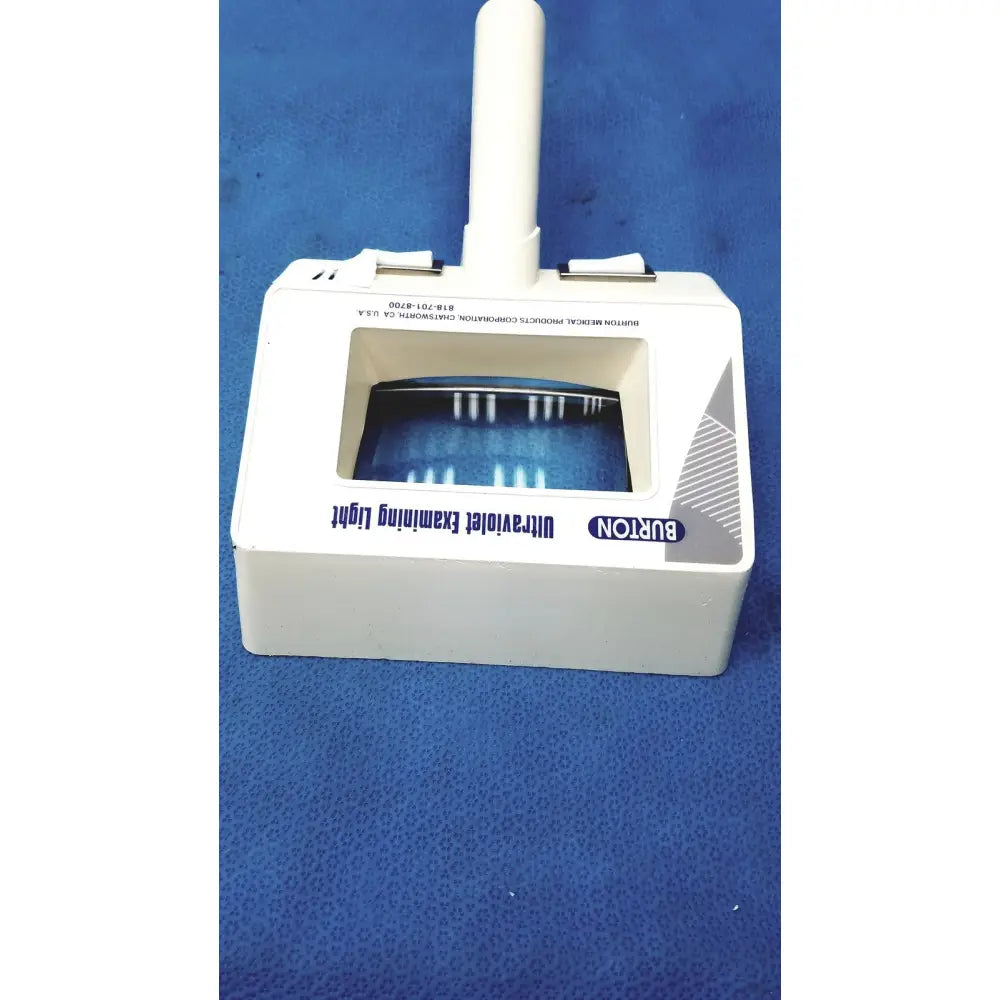 Burton ultraviolet examining light 31601 with white vertical handle and rectangular window showing blue uv light strips