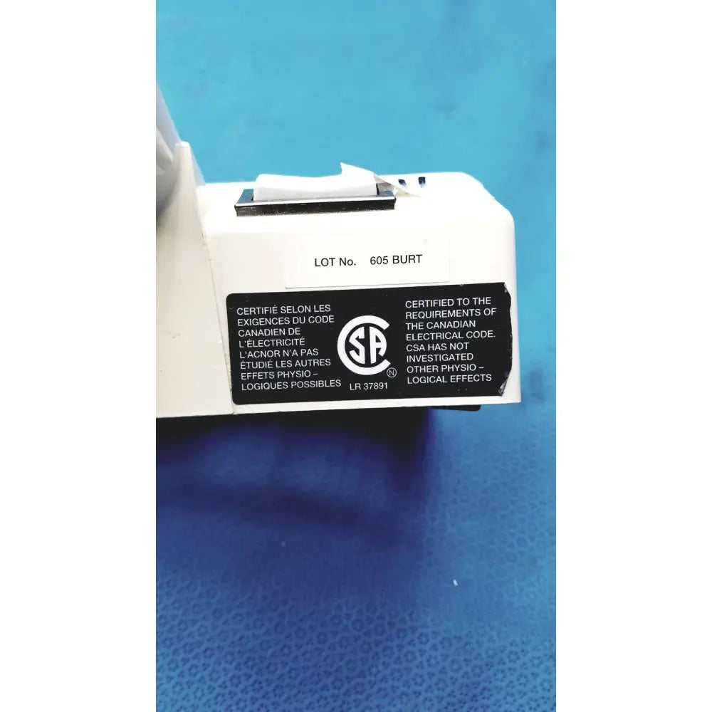 White plastic burton ultraviolet examining light with black certification label and silver switch for ultraviolet examining use