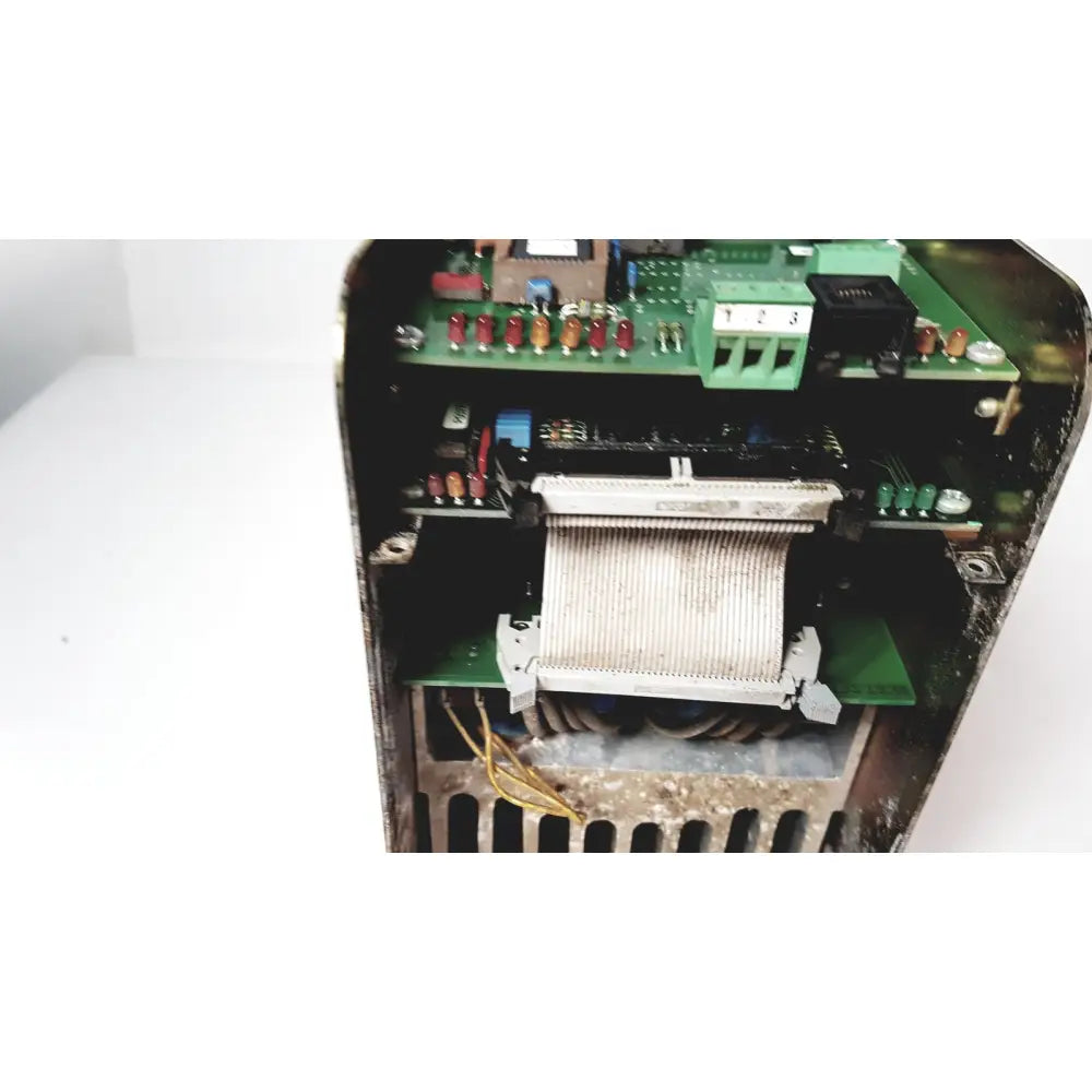 Internal components of a black bystronic amplifier cno2 25a featuring green circuit boards with red capacitors and yellow wiring