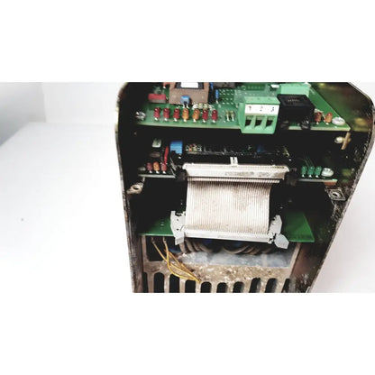 Internal components of a black bystronic amplifier cno2 25a featuring green circuit boards with red capacitors and yellow wiring